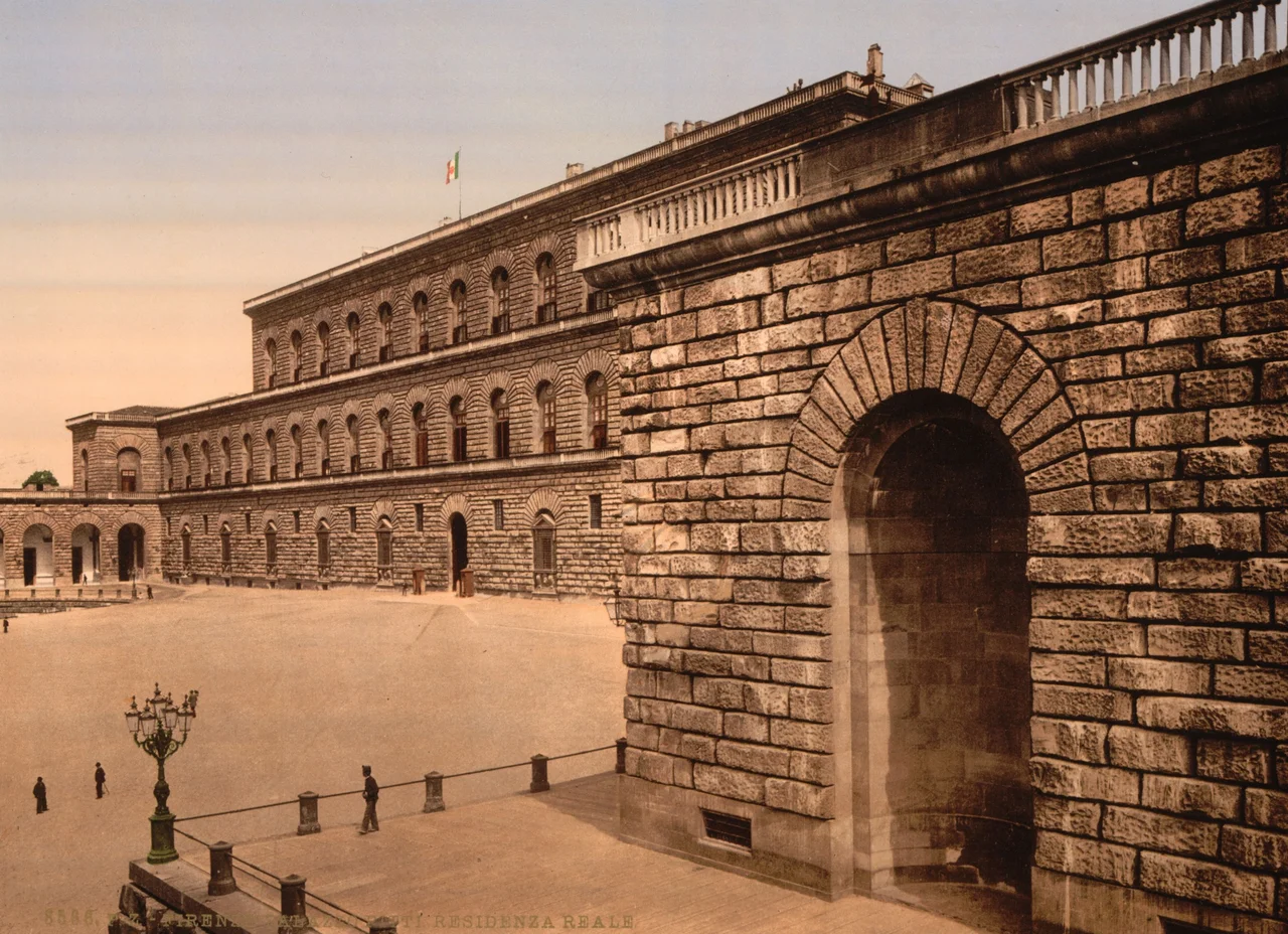 The rusticated facade of Palazzo Pitti in Florence with its arched passage, photographed around 1900
