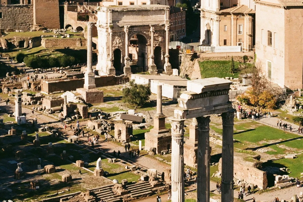 The ancient ruins and standing columns of the Roman Forum in Rome