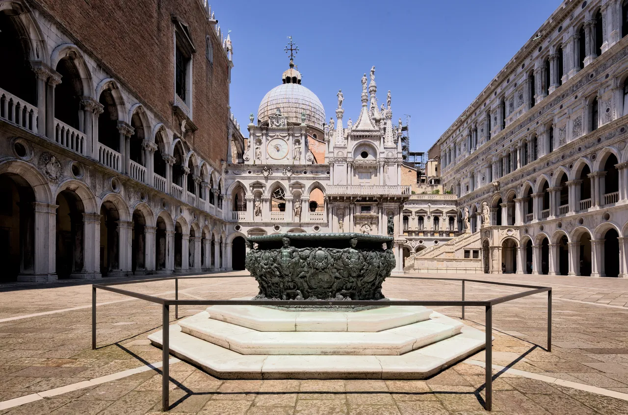 The arcaded courtyard of the Doge's Palace in Venice with its bronze well-head
