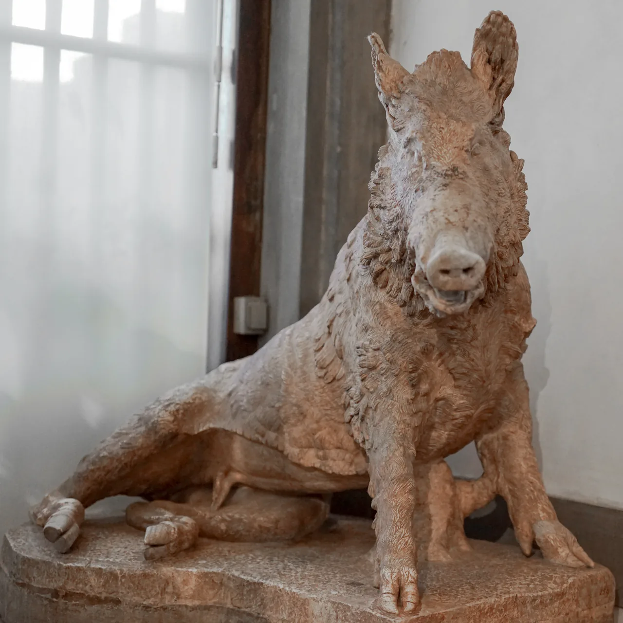 The ancient Roman boar sculpture displayed at the Uffizi Gallery, Florence