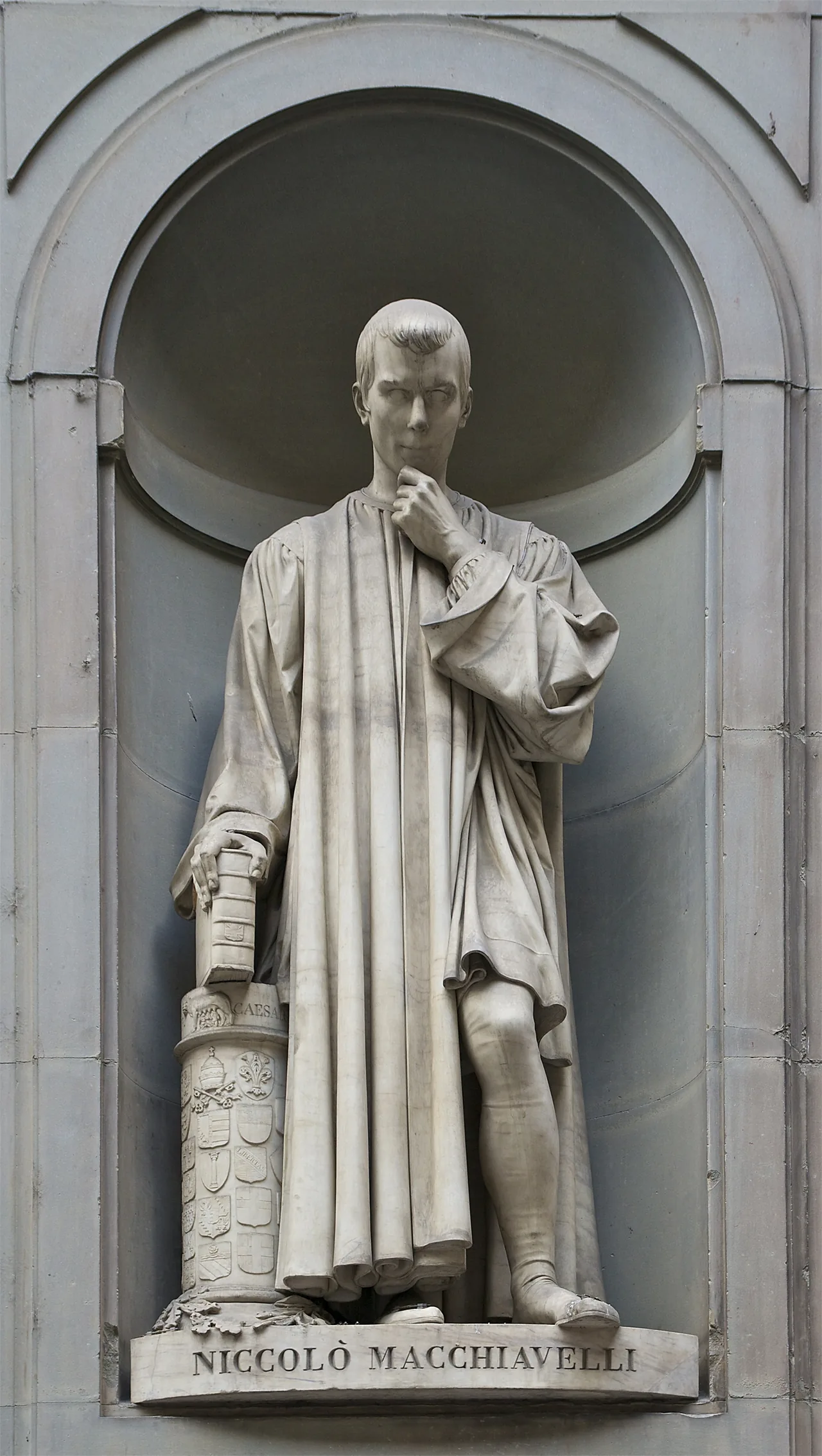The statue of Niccolò Machiavelli in a niche of the Uffizi colonnade, Florence