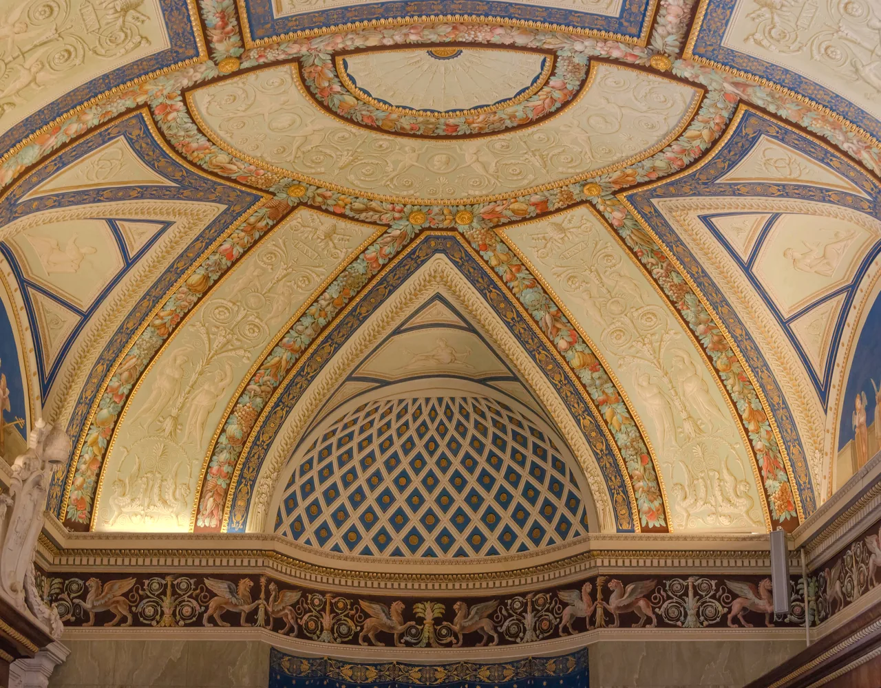 The painted and stuccoed vaulted ceiling of a hall in the Vatican Museums